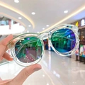 Detail of round kids sunglasses with transparent frames and colorful gradient reflective lenses - Transparent Green Green Mirror