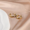Detailed macro view of gold hoop earrings with multi-color zircon stones on beige silk - Gold (E00288-3)