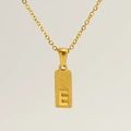 Macro shot of rectangular gold pendant with embossed letter E on a fine link chain - Letter E