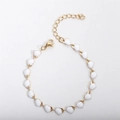 Detail of 18k gold plated heart bracelet with white enamel drops and lobster clasp - White