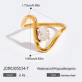 Modern 18K gold stainless steel wave ring featuring a clear oval zirconia stone inlay - JDR0305034 Gold Wave Curve Size 7