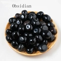 Polished black obsidian tumbled stones in a wooden tray for aromatherapy and decor - 100g/Pack / Obsidian