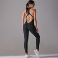 Detail of black backless yoga jumpsuit featuring halter neck and ruched butt-lifting design - S / Black