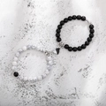 Detail of magnetic heart clasp connecting black lava stone and white turquoise bead bracelets - Howlite Black Matte Heart B&W