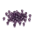 Macro shot of deep purple faceted bicone crystal glass beads for jewelry DIY crafts - 3mm / Violet
