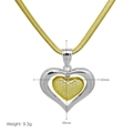 Macro detail of dual-tone heart pendant with dimensions 30mm x 36mm on snake chain - Two-tone Double Heart Pendant