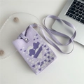 Detail of purple knitted phone bag featuring white heart patterns and a snap closure - Purple Hearts