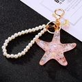 Pink starfish keychain with white pearl bracelet and golden metal ring - Single OPP Bag Packaging / Pearl + Jelly Shell Starfish Pink