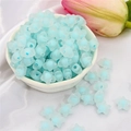 Light blue frosted acrylic star beads for DIY jewelry making displayed in a bowl - Blue Frosted Star (83pcs)