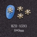 Macro shot of 8x9mm gold snowflake nail charms with crystal for Christmas manicure - Gold Rhinestone Hollow Snowflake Style (A593)