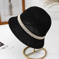 Detail of hand-woven black straw bucket hat with beige stripe on a metal display stand - One Size / Black (Beige Stripe)