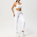 Detailed view of white high-stretch knit sports bra and high-waist yoga leggings set - XS / Off-White