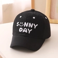 Close-up of white 3D SUNNY DAY embroidery on black cotton canvas baseball cap - 52cm (2-5 Years) / Black