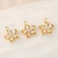 Macro view of 18k gold plated flower pendants with inlaid sparkling white zircon crystals - PJ0108-Gold (Five-Petal Flower)