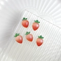 Five glossy red-orange strawberry charms with green leaves for DIY nail art and crafts - Realistic Radish