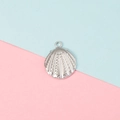 Detailed view of a silver shell pendant with embossed texture on a soft colored background - Fan-shaped Wavy Shell Style (8#)