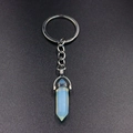 Detailed view of opalite hexagonal crystal pendant on a silver metal keychain ring - Opalite