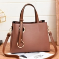 Brown lychee texture PU leather handbag with gold ring hardware and long strap - Pink