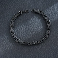 Detailed macro view of a men's black stainless steel Byzantine link chain bracelet - Emperor Chain / Black