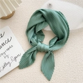 Elegant dark green pleated square silk scarf for women in a stylish knotted display - Emerald Green