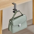 Portable black metal desk hook holding a green handbag on a wooden tabletop edge - Foldable Type / Gray