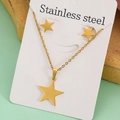 Macro view of gold stainless steel star necklace and earrings set on display card - Pentagram Set B23