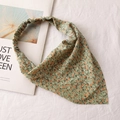 Detail of floral chiffon headscarf with orange flowers on light green fabric background - 18# Triangular Hairband