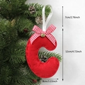 Red felt Christmas tree ornament letter C with plaid bow and bell hanging on branch - C-Bell