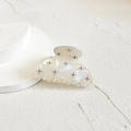 Detail of white iridescent hair claw clip with metallic stud accents on textured surface - 6.5*4*4.5cm / White Small