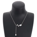 Silver tulip pendant necklace with shell inlay and pearl drop on elegant black bust - Steel