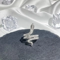 Macro shot of silver snake ring with scale texture on dark stone with ice accents - Style 12 Adjustable Ring