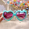 Kids heart-shaped sunglasses in teal and pink with a cute 3D bow accent - Light Green Heart Bow