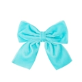 Close-up of light blue velvet bow hair clip showing soft fabric texture and detail - Teal Blue