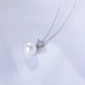 Macro detail of S925 silver necklace with white pearl and heart-shaped zircon pendant - 925 Silver / White