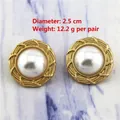 Detailed view of vintage matte gold pearl earrings with 2.5cm diameter and 12.2g weight - 0343/Gold Woven Interlaced Edge Pearl Studs