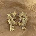 Macro shot of layered gold butterfly dangle earrings on a textured vintage paper background - 925 Sterling Silver Earring Post/Alloy / Gold