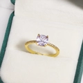 Macro shot of a lavender cushion-cut gemstone ring with a gold diamond-encrusted band - Lavender Square Cushion Cut Gemstone Style (金色12)