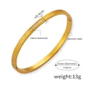Detail showing 0.4cm width and 6cm diameter of the gold-plated rhinestone titanium bangle - Gold Rhinestone Bangle