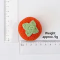 Handmade knitted orange persimmon pendant with green leaves measuring 4.5cm in diameter - Combed Cotton Knitted Persimmon