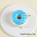 Blue glazed artificial donut model with white icing swirls, 7cm diameter squishy toy - 7cm Diameter, 3cm Height / Blueberry Blue
