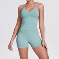 Detail of light cyan seamless knit yoga set showing V-neck halter top and texture - Pale Green