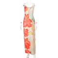 Close-up of the cutout neckline with tie detail on this orange floral maxi dress - S / Orange