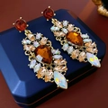 Boucles d'oreilles vintage en or avec zircons ambrés en goutte sur un écrin à bijoux - Style Goutte d'Eau Ambre (Perno en Argent Sterling 925)