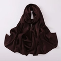Detail shot of draped dark brown chiffon shawl with a smooth and glossy texture - Coffee