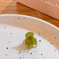 Mini green translucent hair claw clip with FRANCE handmade text on a ceramic plate - Fruit Green