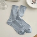 Chaussettes bleu clair à pois noirs avec bords à volants et maille de coton côtelée - Taille unique / Bleu Pastel