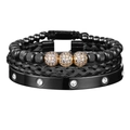 Dettaglio di set bracciali neri in perline, intrecciati e metallo con accenti dorati - Set Nero + Oro