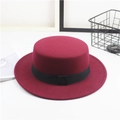 Detail of burgundy wool felt flat top boater hat with a minimalist black ribbon band - One Size / Square Ribbon / Burgundy