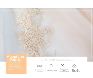 Macro shot of gold floral embroidery on white polyester bridal gown fabric