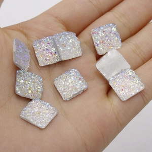 Detailed view of 12mm iridescent resin square cabochons for DIY jewelry making